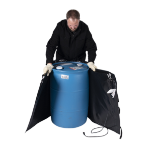 Man wrapping industrial heating blanket around blue drum/barrel