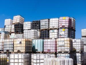 Stacks of Different Colored IBC Totes