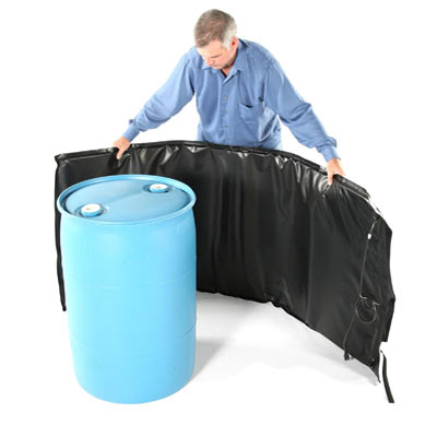 Middle Aged Man Wrapping a Barrel Heater Around a Barrel
