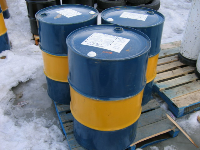 barrels on a pallet in the snow