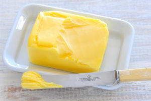 butter on dish with knife